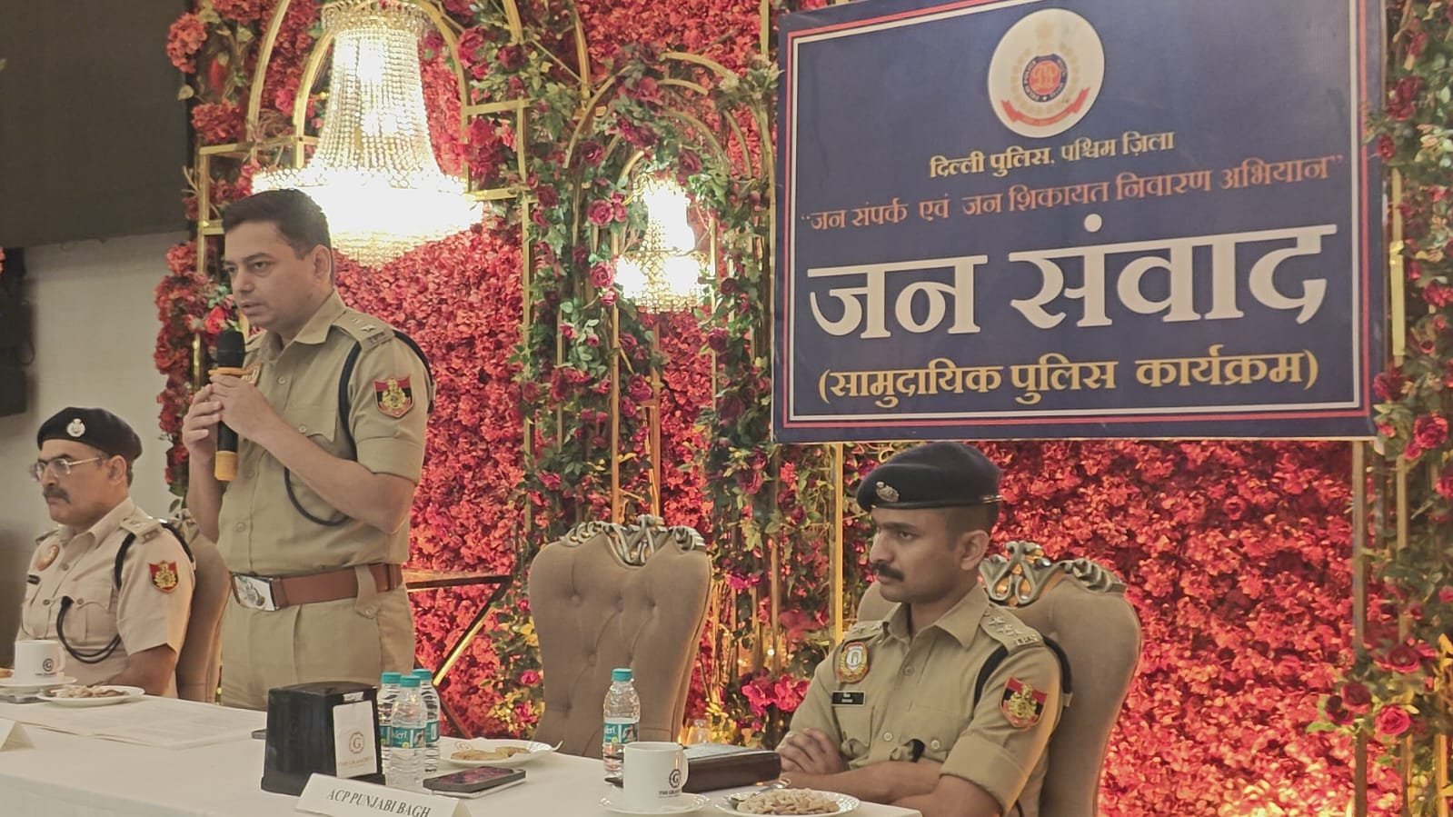 DCP West Mr. Sharad Bhaskar Darade interacting with citizens during a public dialogue at Lavanya Banquet Hall, Motinagar